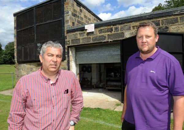 Vice chairman Robert Hodson, left, and secretary Mark Shaw by the storeroom from where the mowers were stolen.