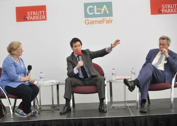 Country Life managing editor Kate Green, Environment Minister Rory Stewart, and CLA president Henry Robinson at the CLA Game Fair Theatre.