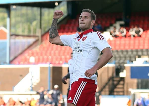 Billy Sharp celebrates his goal against Macclesfield Town.