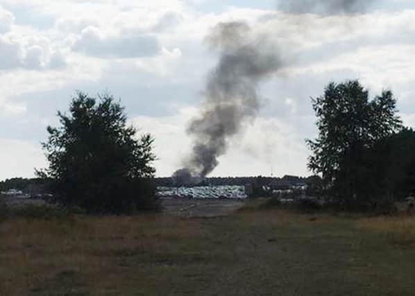 Smoke rising after the plane crash at Blackbushe in Hampshire