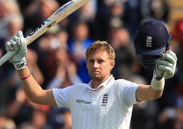 England batsman Joe Root celebrates his century against Australia during the First Ashes Test in Cardiff. (Photo credit: Nick Potts/PA Wire).