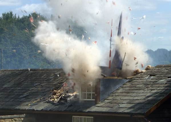Photo taken from the soap Emmerdale, of a helicopter crashing into the Emmerdale Village Hall where Debbie and Pete are holding their wedding reception. (Picture: PA)