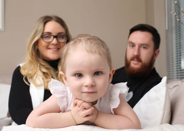 Myla Adams, two, from Gildersome, with her parents Stephanie and Tony.