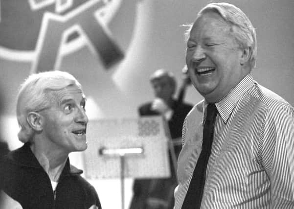 Savile pictured with former PM Heath