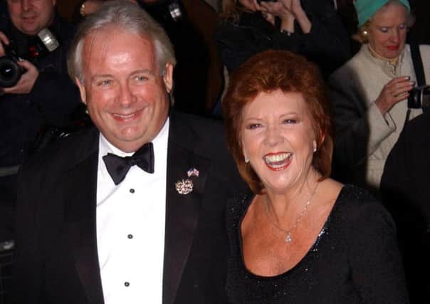 Cilla Black and Christopher Biggins arriving at Claridges Hotel in London for the wedding of actress Joan Collins to Percy Gibson.