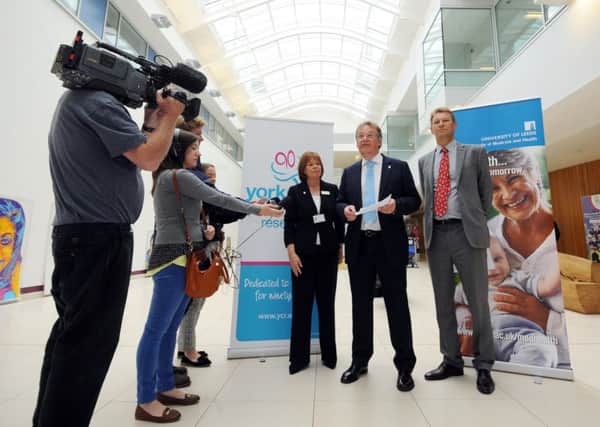 Charles Rowett, of Yorkshire Cancer Research, addresses the press at Leeds St James's Hospital with Dr Yvette Oade, of Leeds Teaching Hospitals, and Professor Paul Stewart, from the University of Leeds. Picture by Simon Hulme.
