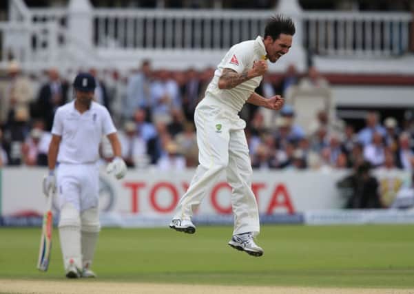Australia bowler Mitchell Johnson celebrates taking the wicket of England batsman Joe Root at Lord's (Picture: Nick Potts/PA Wire).