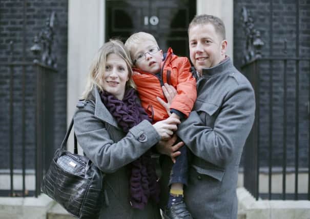 Six-year-old Sam Brown, of Otley, visits Downing Street with his parents to campaign for Vimizim to be funded. Picture by Yui Mok/ PA Wire.