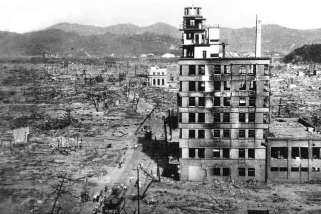 The shell of a building stands amid acres of rubble in this view of the Japanese city of Hiroshima. (AP Photo/Mitsugi Kishida, File)
