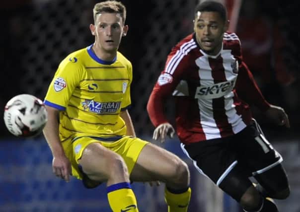 Owls Tom Lees closes down Bees Andre Gray