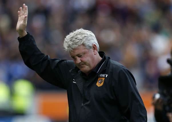 Hull Citys manager Steve Bruce waves to the fans after relegation was confirmed against Manchester United (Picture: PA).