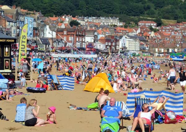 Visitors on the  South Bay, Scarborough as the county basks in sunshine. Picture by Tony Johnson