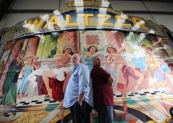 David Littleboy, left, and Roger Sibley with the giant waltzer from 1938 at their workshop near Wakefield. PICTURES: SIMON HULME