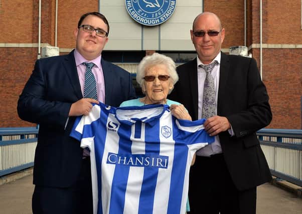 Lifelong Sheffield Wednesday supporter Ivy Gulson, 100 invited to the club as the oldest season ticket holder, Ivy is pictured with Great Grandson Adam Glasby, left and Grandson Neville Glasby