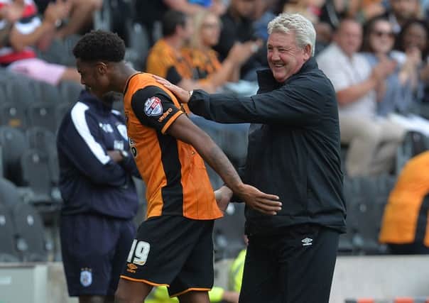Hull City manager Steve Bruce congratulates Chuba Akpom after he is substituted during the Sky Bet Championship match at the KC Stadium, Hull. Picture: Anna Gowthorpe