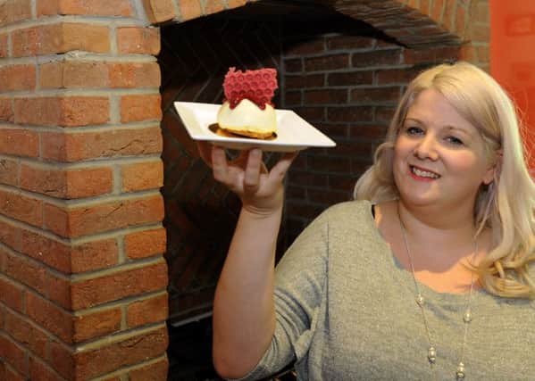 070815   Charlotte Marrifield from Harrogate  with her new raspberry and vanilla cheesecake  in her kitchen (Gl1006/78f)