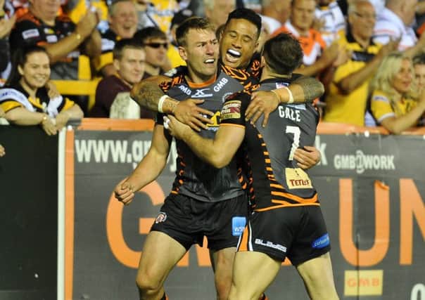 Michael Shenton, left, is congratulated after one of his four tries.