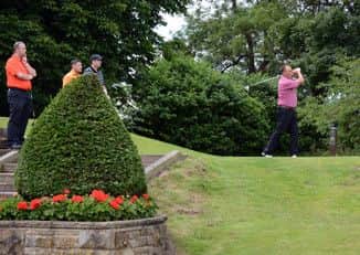 A group tees off at the first at Headingley GC.