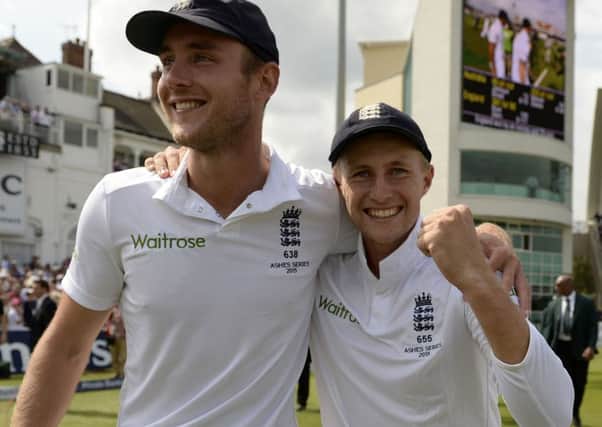 England's Stuart Broad and Joe Root celebrate winning the Ashes