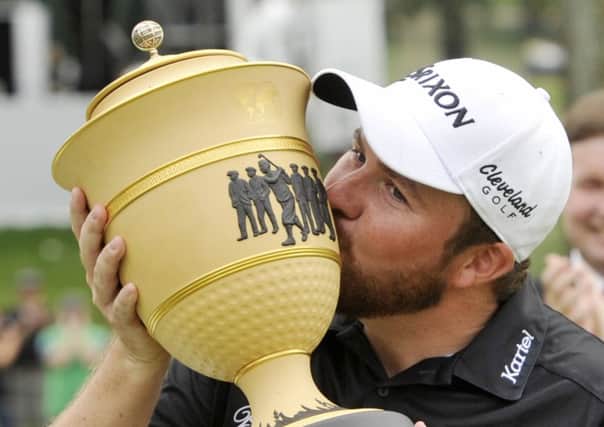 Ireland's Shane Lowry kisses the trophy after winning the Bridgestone Invitational at Firestone Country Club in Akron, Ohio (Picture: Phil Long/AP).