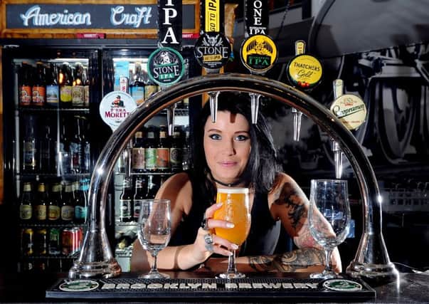 Briony Rose, 25, Bar Supervisor at Head of Steam, Mill Hill, Leeds, with a third of a pint. 
Drinking smaller measures is becoming more popuar, say Camra.
Picture: James Hardisty