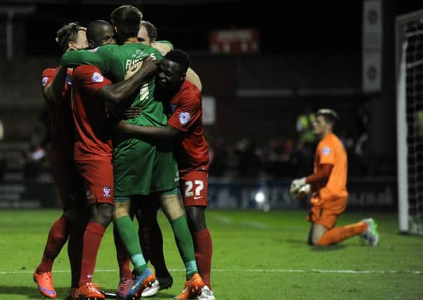 The Minstermen celebrate after beating Bradford City in the penalty shootout.