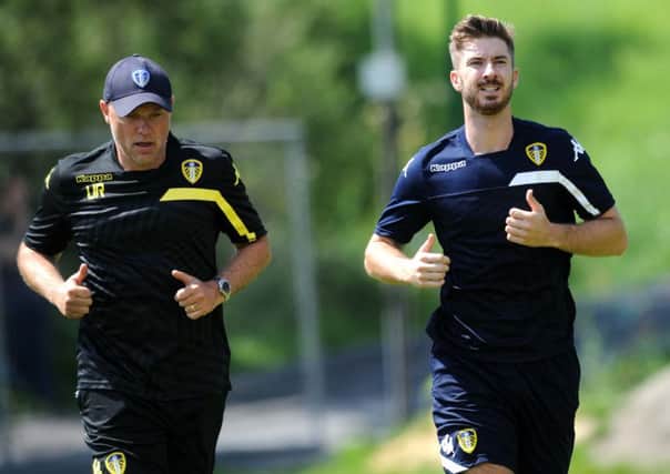 Leeds United head coach Uwe Rösler trains with Luke Murphy.