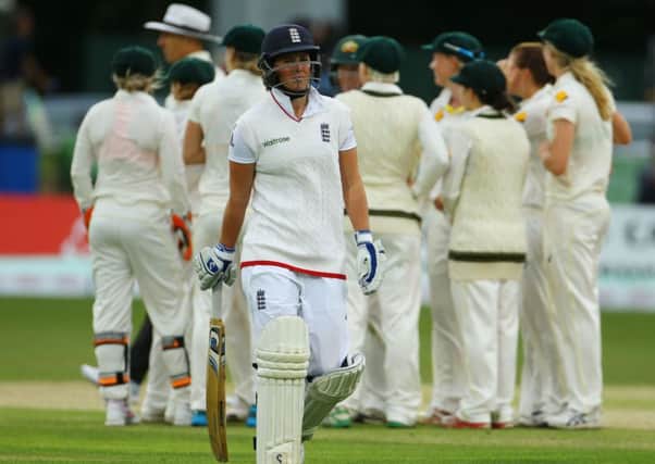 England's Georgia Elwiss leaves the field after losing her wicket.