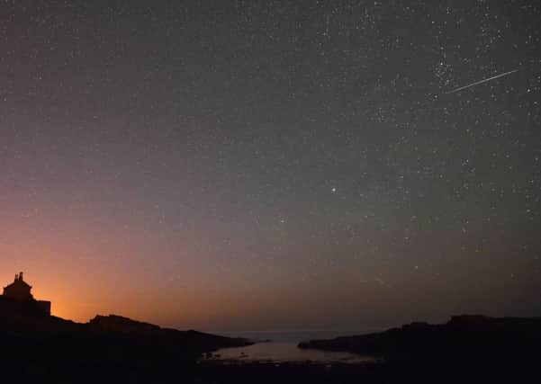 A shooting star in the skies over the Bathing House at Howick in Northumberland as the annual Perseids meteor shower peaked, delighting viewers in the Midlands and the North. (Picture: Owen Humphreys/PA Wire)