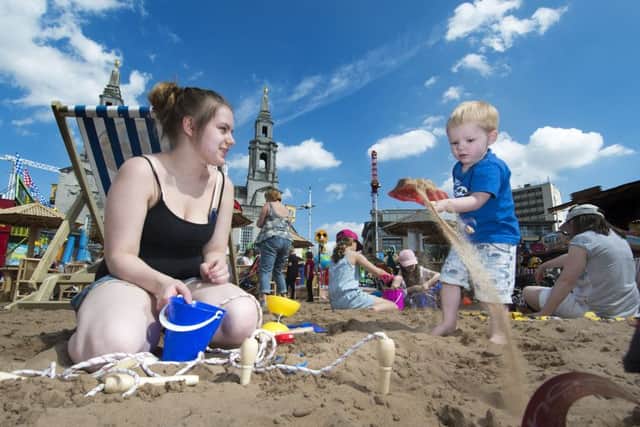 Kimberley Green with Ryan Green, two, from Headingley, at the Leeds Beach in Millennium Square
