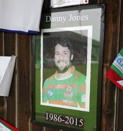 Flower and tributes for Danny Jones at Keighley Cougars ground.