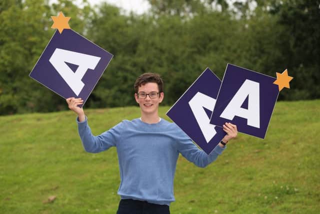 James Micklethwaite, aged 18, from Grammar School at Leeds, celebrates his A-Level results (A*,A*,A, & A* for an EPQ), outside Grammar School at Leeds, in Leeds, West Yorkshire, on 13 August 2015. James has received a core scholarship at Norwich Cathedral, where he'll be able to show off his talent as an opera tenor.  rossparry.co.uk/Harry Whitehead