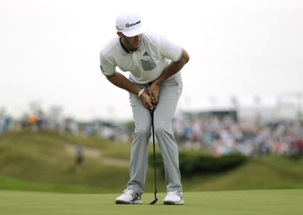 Dustin Johnson watches an eagle putt drop during the first round of the US PGA championship at Whistling Straits (Picture: Jae Hong/AP).