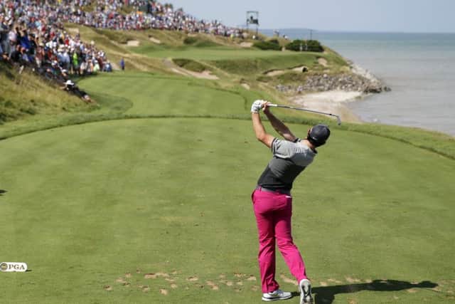 Defending champion Rory McIlroy hits his tee shot on the seventh hole during the first round of the US PGA championship at Whistling Straits (Picture: Jae Hong/AP).