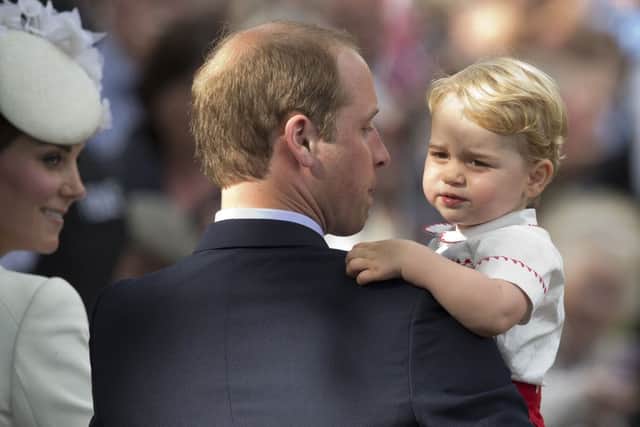 The Duke and Duchess of Cambridge with Prince George at Princess Charlotte's christening
