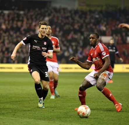 Rotherham's Richie Smallwood fires the ball past Michail Antonio in last season's game v Forest