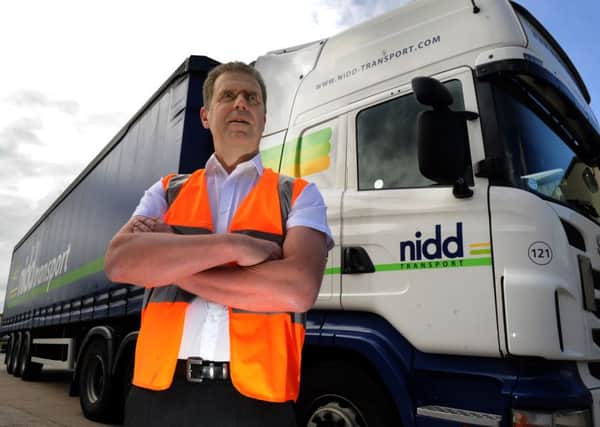 130815   Steve Curtis Commercial Director of Nidd Transport in front of one of their lorries at Melmerby near Ripon. (GL1006/86a)