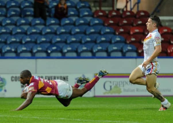 Jermaine McGillvary dives over for a try.