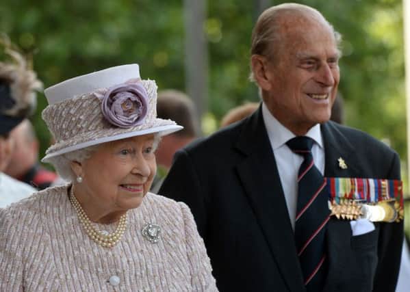 The Queen and the Duke of Edinburgh arrive at St Martin-in-the-Fields in London.