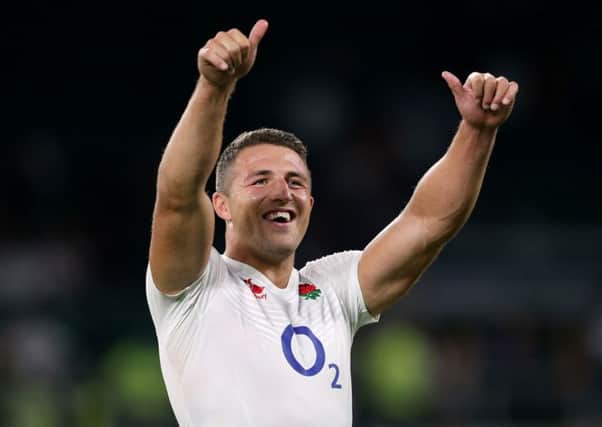 England's Sam Burgess celebrates victory.