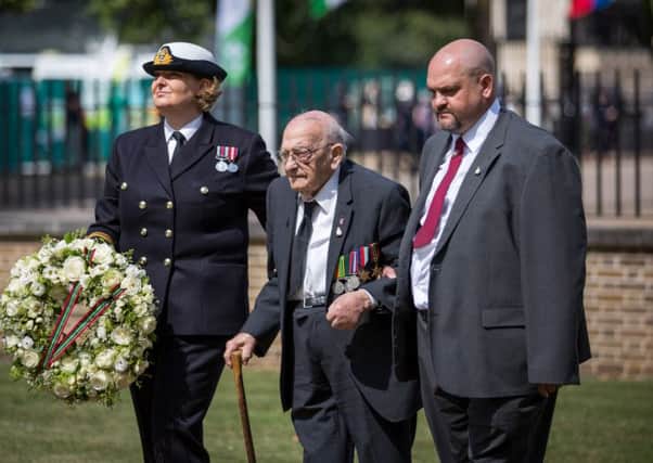 Janette Cooper (left) from the Queen Alexandras Royal Naval Nursing Service and Gordon Smith (centre), a veteran of the Royal Army Ordnance Corps.