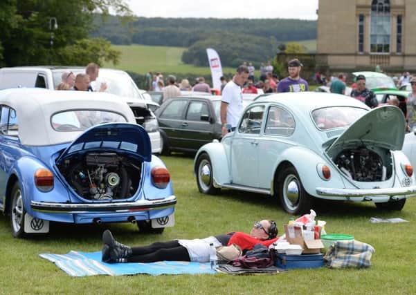 A woman sunbathes during the VW Festival at Harewood House. Picture: Anna Gowthorpe
