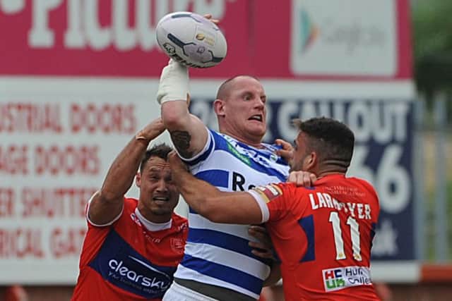 Halifax's Richard Moore gets rid of the ball in the tackle against Hull KR.