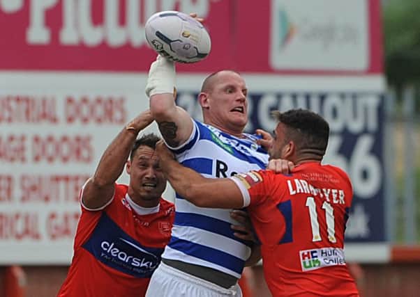 Halifax's Richard Moore gets rid of the ball in the tackle against Hull KR.