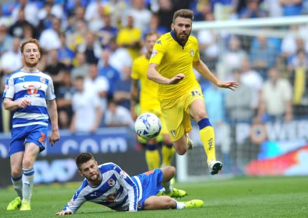 Leeds United's Stuart Dallas jumps out of a challenge from Reading's Oliver Norwood. PIC: Jonathan Gawthorpe.