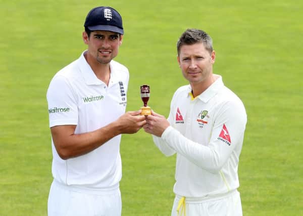 England captain Alastair Cook and Australia captain Michael Clarke pose with the Ashes urn
