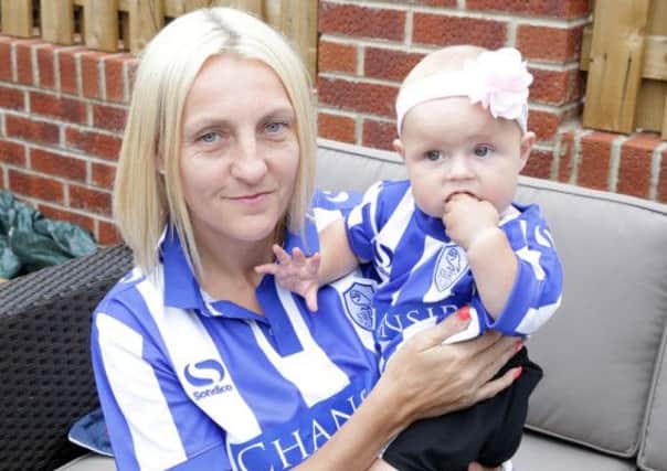 Nicky Rowlinson with baby Charley who are not happy with Sheffield Wednesday's ticket policy.