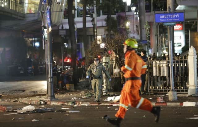 Emergency personnel work at the scene after an explosion in Bangkok