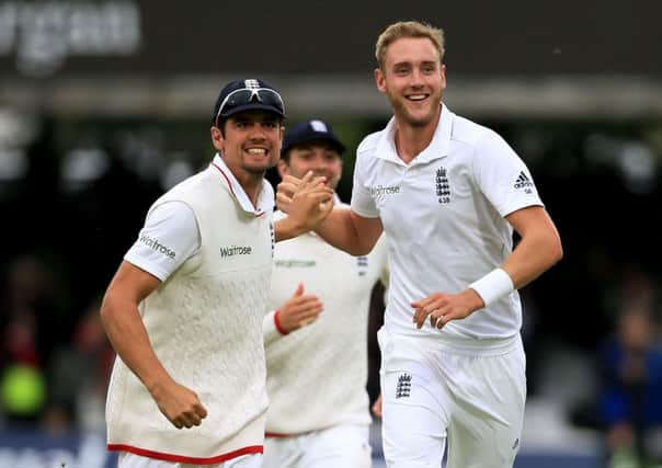 England's Stuart Broad, (right) and Alastair Cook, (left).