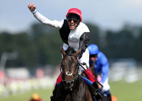 Frankie Dettori celebrating victory on Golden Horn in the Derby at Epsom Racecourse in June.